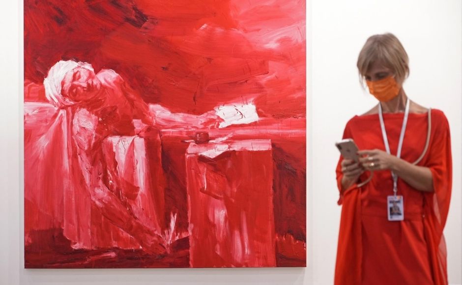 Adeline Ooi, the Asia director of Art Basel, described the event as the organization’s first hybrid fair. | In the picture: A visitor stands next to at an artwork titled "Marat assassins, after David, 2017" created by Chinese artist Yan Pei-Ming at Art Basel in Hong Kong. Photo via The Associated Press/Vincent Yu Adeline Ooi, the Asia director of Art Basel, described the event as the organization’s first hybrid fair. | In the picture: A visitor stands next to at an artwork titled "Marat assassins, after David, 2017" created by Chinese artist Yan Pei-Ming at Art Basel in Hong Kong. Photo via The Associated Press/Vincent Yu