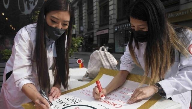 For Asian American health workers, a dual battle with COVID-19 and racism rages on