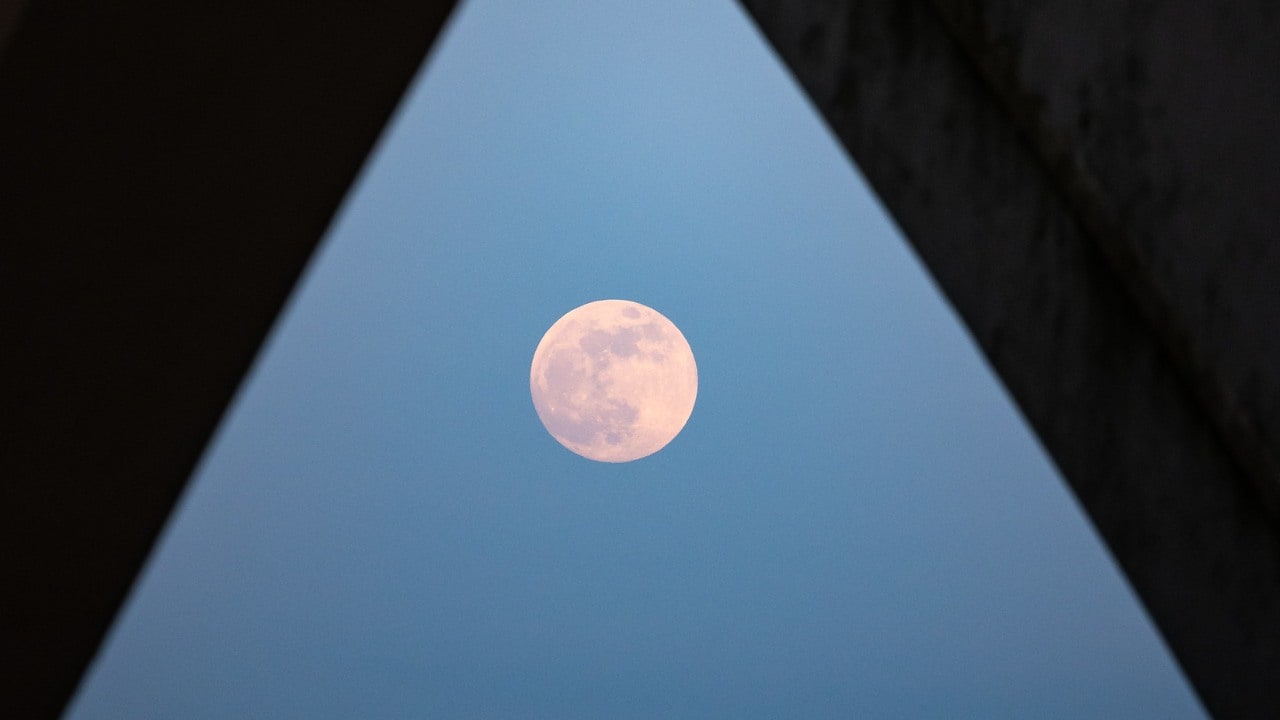 The Moonrise is seen from under the Woodrow Wilson Memorial Bridge in Virginia, USA. Image credit Flickr/NASA Bill Ingalls
