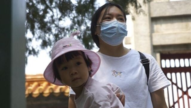 Despite newly-announced easing of birth restrictions, China faces strains as population ages, birth rate falls