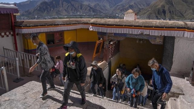 Tibet's tourism boom poses risks to the country's fragile environment, historic sites Tibet's tourism boom poses risks to the country's fragile environment, historic sites