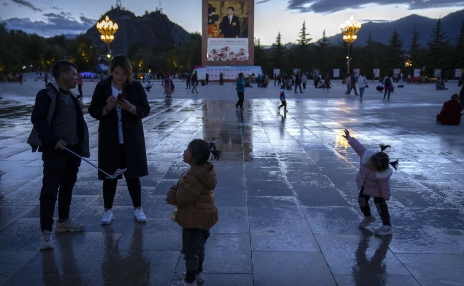 Among the most popular natural sites is Namtso Lake, ringed by snow-capped peaks and Buddhist shrines, with yak herds and migrating birds on the horizon. Further development of the site must be done carefully to avoid damaging what makes it attractive, Ge said. “It will be hard to protect the ecology and culture of Tibet ... if we don’t have a long-term plan,” he said. “So it is very important to establish a set of values and rules of behaviour for travel in Tibet while building the facilities.” | In the picture: Tourists stand near a large mural depicting Chinese President Xi Jinping on a square near the Potala Palace in Lhasa in western China's Tibet Autonomous Region, on Tuesday, 1 June, 2021. Photo via The Associated Press/Mark Schiefelbein Among the most popular natural sites is Namtso Lake, ringed by snow-capped peaks and Buddhist shrines, with yak herds and migrating birds on the horizon. Further development of the site must be done carefully to avoid damaging what makes it attractive, Ge said. “It will be hard to protect the ecology and culture of Tibet ... if we don’t have a long-term plan,” he said. “So it is very important to establish a set of values and rules of behaviour for travel in Tibet while building the facilities.” | In the picture: Tourists stand near a large mural depicting Chinese President Xi Jinping on a square near the Potala Palace in Lhasa in western China's Tibet Autonomous Region, on Tuesday, 1 June, 2021. Photo via The Associated Press/Mark Schiefelbein