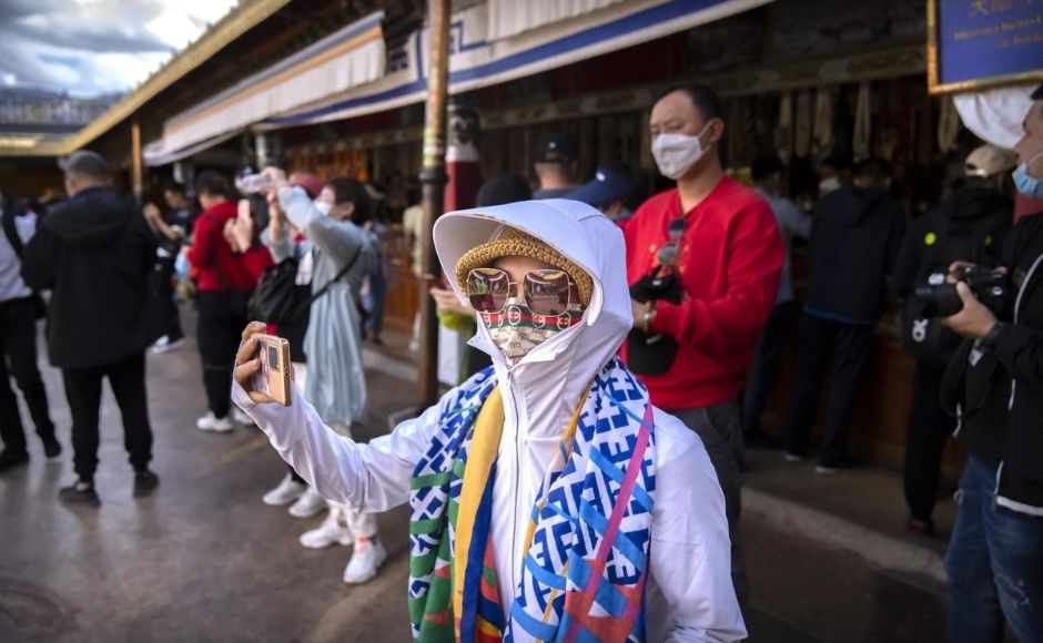 The tourism sector reinforces government propaganda, Yeh said. The ruling Communist Party says it liberated hundreds of thousands of serfs when it overthrew the theocracy in 1951 and has since brought economic development to the high plateau that borders the Himalayas. “Rewriting of history is very much a part of the tourism landscape,” Yeh said. | In the picture: A tourist takes a smartphone photo at the Jokhang Temple in Lhasa in western China's Tibet Autonomous Region, on Tuesday, 1 June, 2021. Photo via The Associated Press/Mark Schiefelbein The tourism sector reinforces government propaganda, Yeh said. The ruling Communist Party says it liberated hundreds of thousands of serfs when it overthrew the theocracy in 1951 and has since brought economic development to the high plateau that borders the Himalayas. “Rewriting of history is very much a part of the tourism landscape,” Yeh said. | In the picture: A tourist takes a smartphone photo at the Jokhang Temple in Lhasa in western China's Tibet Autonomous Region, on Tuesday, 1 June, 2021. Photo via The Associated Press/Mark Schiefelbein