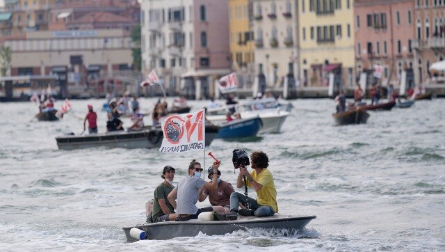 Venice's cruise ships restart for first time since pandemic, spark environmental protests