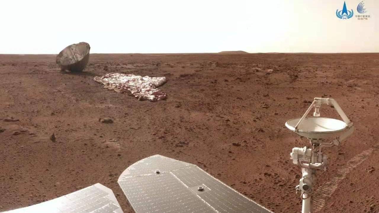 The burnt yet unbroken protective shell (far left), the deflated parachute (far right) and part of China's Mars rover. /China National Space Administration
