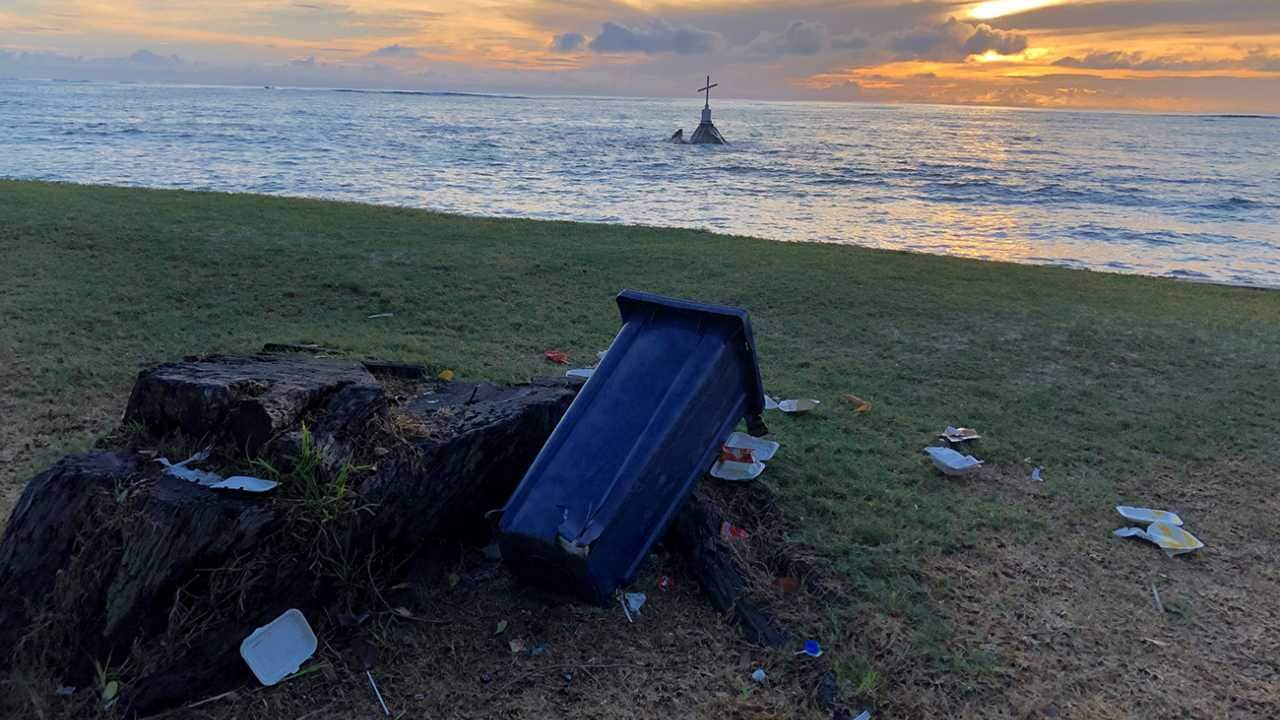 Plastic waste can be found even in the most serene places. Here, it overshadows the beauty of the sunrise and the peacefulness symbolised by the cross. Photo by Sienna Goldstein (Seychelles)