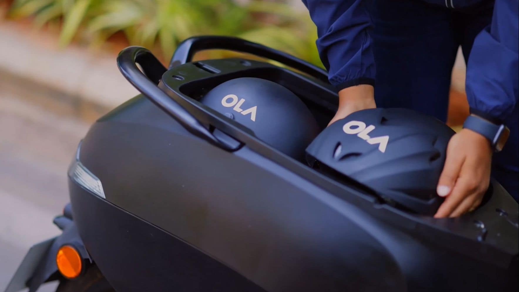 The Ola electric scooter can store two half-face helmets in its under-seat storage bay. Image: Ola Electric