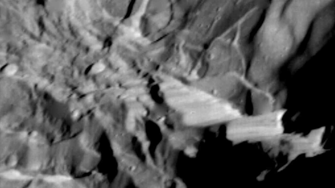 Verona Rupes, about 50km long and several km high, but not actually so cliff-like as it appears as seen by Voyager 2 during its 1986 flyby. NASA/JPL 