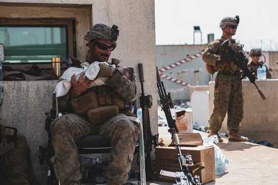 Picture of US Marine calming Afghan baby during Kabul evacuation goes viral; see image here