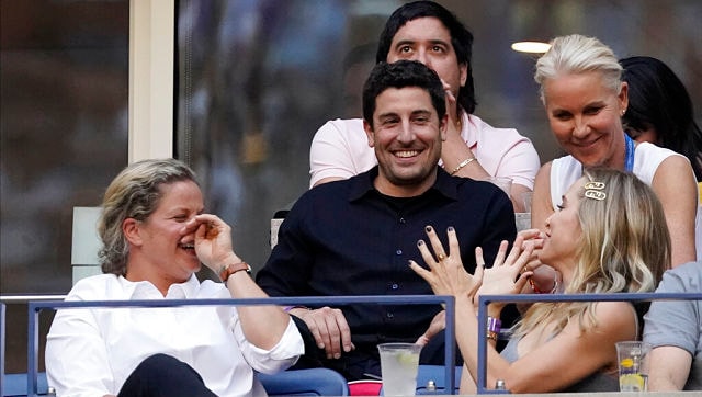 Actor Jason Biggs (C) talks with Kim Clijsters while watching the US Open women's singles final. AP Actor Jason Biggs (C) talks with Kim Clijsters while watching the US Open women's singles final. AP