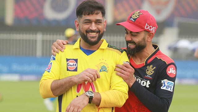 With a sandstorm in Sharjah delaying the toss for their Indian Premier League match, CSK captain Mahendra Singh Dhoni shared a few light moments with his RCB counterpart Virat Kohli at the Sharjah Cricket Stadium on Firday. Sportzpics for IPL With a sandstorm in Sharjah delaying the toss for their Indian Premier League match, CSK captain Mahendra Singh Dhoni shared a few light moments with his RCB counterpart Virat Kohli at the Sharjah Cricket Stadium on Firday. Sportzpics for IPL