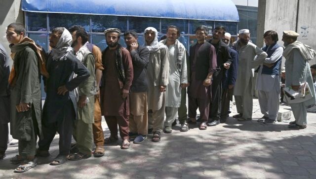 Cash-starved Afghans form long queues as bank operations resume