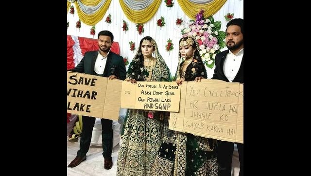 Two newly-married couples hold placards to protest against BMC cycle track Two newly-married couples hold placards to protest against BMC cycle track