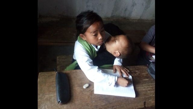 Manipur's 10-year-old girl attends school while babysitting her sister; minister extends support Manipur's 10-year-old girl attends school while babysitting her sister; minister extends support
