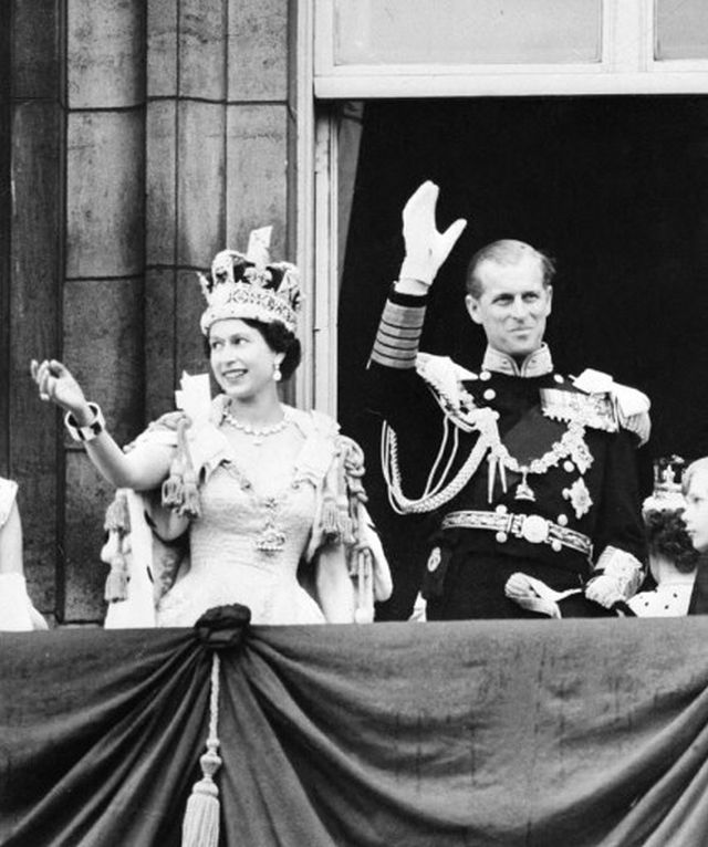 Queen Elizabeth II with her husband Prince Philip, the Duke of Edinburgh waves at the crowd after Her Majesty’s coronation at Westminster Abbey in London. Elizabeth II formally became the Queen of England after the Archbishop placed St. Edward’s solid gold crown upon her head. According to Vanity Fair, once the crown was placed, the congregation shouted “All hail the Queen” three times. AP Queen Elizabeth II with her husband Prince Philip, the Duke of Edinburgh waves at the crowd after Her Majesty’s coronation at Westminster Abbey in London. Elizabeth II formally became the Queen of England after the Archbishop placed St. Edward’s solid gold crown upon her head. According to Vanity Fair, once the crown was placed, the congregation shouted “All hail the Queen” three times. AP