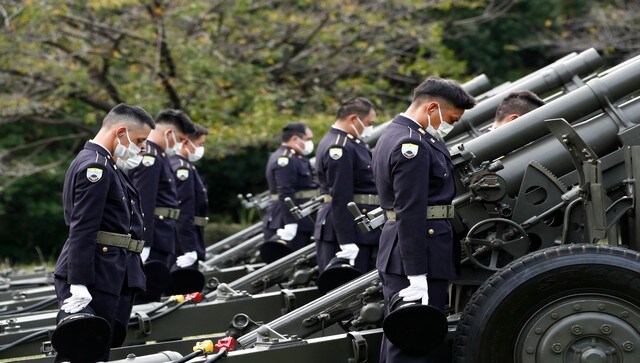 Japanese Ground Self-Defense Force personnel takes a moment of silence after firing cannons at the Nippon Budokan grounds. On Tuesday. Tokyo witnessed heightened security. AP Japanese Ground Self-Defense Force personnel takes a moment of silence after firing cannons at the Nippon Budokan grounds. On Tuesday. Tokyo witnessed heightened security. AP