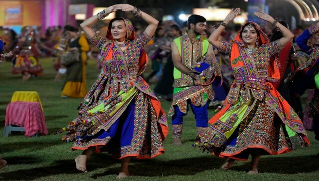 Revellers wearing traditional clothes perform garba in Ahmedabad. The nine-day-long festival of Navratri began on 26 September this year. One of the main highlights of Navratri celebrations is the traditional dance called Garba. AP Revellers wearing traditional clothes perform garba in Ahmedabad. The nine-day-long festival of Navratri began on 26 September this year. One of the main highlights of Navratri celebrations is the traditional dance called Garba. AP