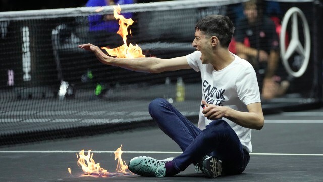 Laver Cup protester sets court, arm on fire, delays match by five minutes Laver Cup protester sets court, arm on fire, delays match by five minutes