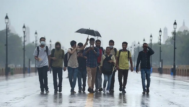 People walk on Kartavya Path in Delhi amid heavy rainfall. PTI People walk on Kartavya Path in Delhi amid heavy rainfall. PTI