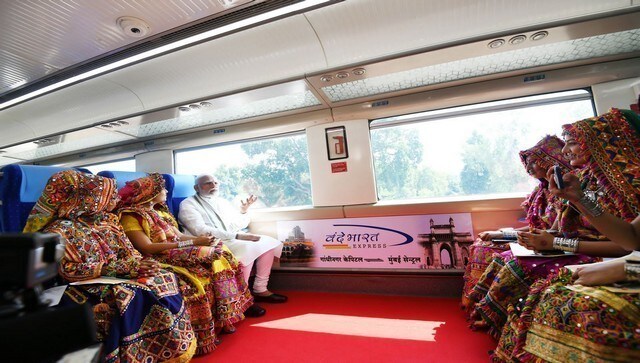 Prime Minister Modi interacts with women wearing traditional attires during a trip in the Vande Bharat Express. News18 Prime Minister Modi interacts with women wearing traditional attires during a trip in the Vande Bharat Express. News18