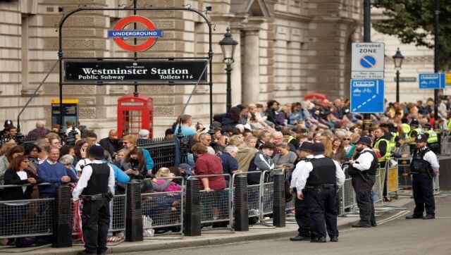 Members of the public wait at Whitehall road just minutes before the ceremonial procession of the coffin of Britain’s Queen Elizabeth II from Buckingham Palace to the Palace of Westminster, in London. AFP Members of the public wait at Whitehall road just minutes before the ceremonial procession of the coffin of Britain’s Queen Elizabeth II from Buckingham Palace to the Palace of Westminster, in London. AFP