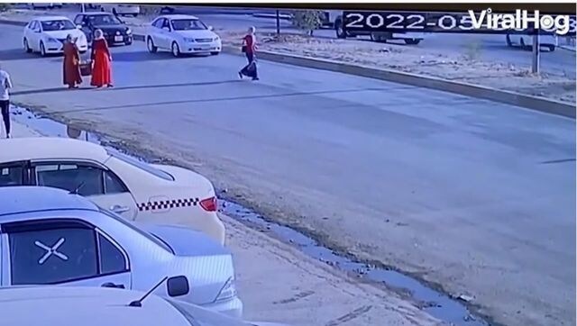 Careless woman miraculously escapes getting hit by car; watch Careless woman miraculously escapes getting hit by car; watch