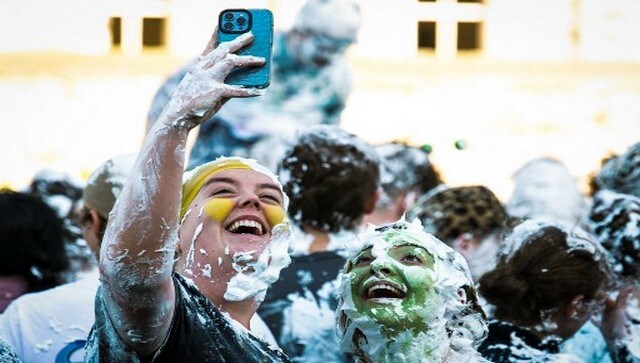 Freshers take selfies while covered in foam. More than a thousand students gathered at the event this year which was held on 17 October. AFP Freshers take selfies while covered in foam. More than a thousand students gathered at the event this year which was held on 17 October. AFP