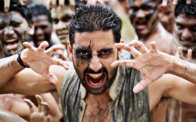 In Mani Ratnam’s Raavan, Bachchan played Beera, an outlandish and outrageous outlaw whose more than just an evil. He’s as much a Robinhood as he’s a Raavan. Ratnam attempts to humanize this demon and by the anti-climax, the lines between <em>Sadhu</em> and <em>Shaitaan</em> are blurred. It becomes tough to deduce who’s black and who’s white. And the bloodshed at the disposal doesn’t even leave any mark for grey. It’s only red. In Mani Ratnam’s Raavan, Bachchan played Beera, an outlandish and outrageous outlaw whose more than just an evil. He’s as much a Robinhood as he’s a Raavan. Ratnam attempts to humanize this demon and by the anti-climax, the lines between <em>Sadhu</em> and <em>Shaitaan</em> are blurred. It becomes tough to deduce who’s black and who’s white. And the bloodshed at the disposal doesn’t even leave any mark for grey. It’s only red.