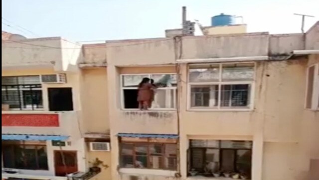 Viral video: Woman risks life by climbing to railings to clean windows, internet reacts