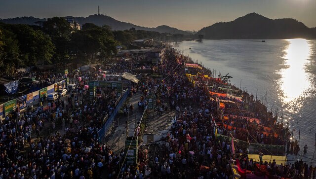 Hindu devotees gather by the river Brahmaputra to offer prayers in Guwahati, Assam, India, 30 October 2022. AP Hindu devotees gather by the river Brahmaputra to offer prayers in Guwahati, Assam, India, 30 October 2022. AP