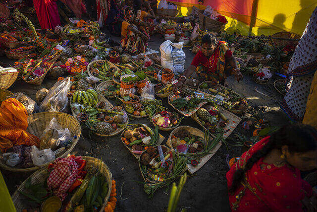 Hindu devotees prepare to offer prayers during Chhath Puja festival in Guwahati, Assam, India, 30 October 2022. AP Hindu devotees prepare to offer prayers during Chhath Puja festival in Guwahati, Assam, India, 30 October 2022. AP