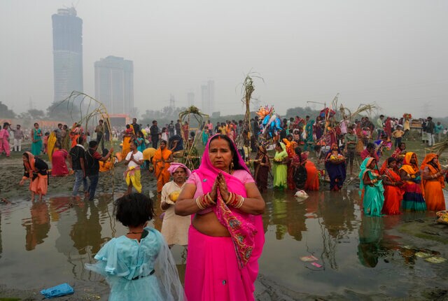 Hindu devotees gather on the banks of the river Yamuna to offer prayers on 30 October 2022. AP Hindu devotees gather on the banks of the river Yamuna to offer prayers on 30 October 2022. AP