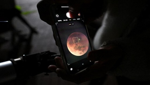 A man uses a smartphone to take picture of a blood moon through a telescope during a total lunar eclipse in Goyang, northwest of Seoul. A Blood Moon gets its red colour when sunlight hitting the Earth’s atmosphere is scattered out. When this happens, the atmosphere filters out most of the blue light. What’s left is a red hue, giving the moon its ‘blood’ colour. AFP A man uses a smartphone to take picture of a blood moon through a telescope during a total lunar eclipse in Goyang, northwest of Seoul. A Blood Moon gets its red colour when sunlight hitting the Earth’s atmosphere is scattered out. When this happens, the atmosphere filters out most of the blue light. What’s left is a red hue, giving the moon its ‘blood’ colour. AFP