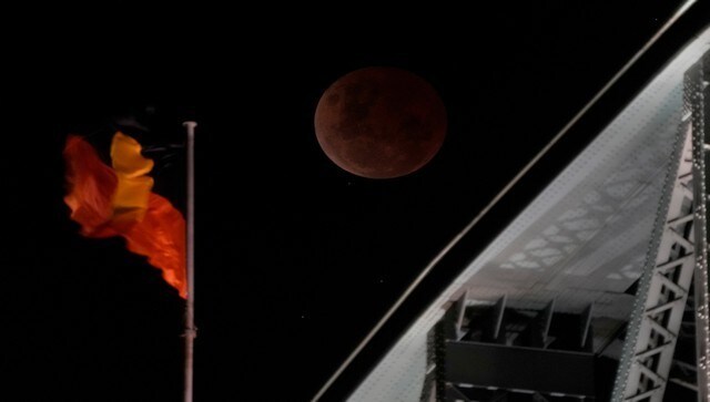 The moon is over the Sydney Harbour Bridge during a lunar eclipse. The total lunar eclipse was visible across North and Central America, Asia, Australia as well as New Zealand. AP The moon is over the Sydney Harbour Bridge during a lunar eclipse. The total lunar eclipse was visible across North and Central America, Asia, Australia as well as New Zealand. AP