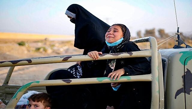 Afghan women weep as Taliban fighters enforce university ban