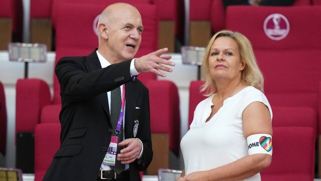 German Football Federation (DFB) President Bernd Neuendorf, left, talks to German Interior Minister Nancy Faeser, right, wearing the One Love armband prior to Germany vs Japan. (AP) German Football Federation (DFB) President Bernd Neuendorf, left, talks to German Interior Minister Nancy Faeser, right, wearing the One Love armband prior to Germany vs Japan. (AP)
