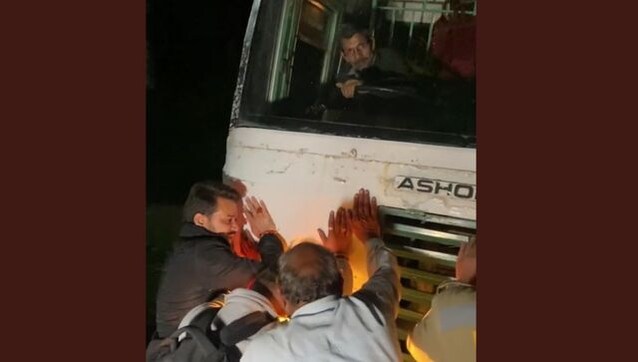 Watch: Minister Anurag Thakur pushes bus stuck in poll-bound Himachal's Bilaspur Watch: Minister Anurag Thakur pushes bus stuck in poll-bound Himachal's Bilaspur