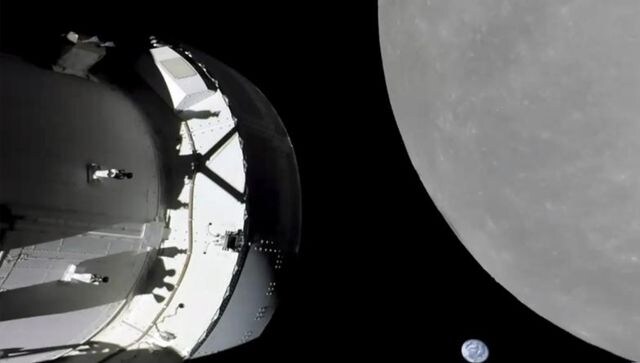 NASA capsule buzzes moon, last big step before lunar orbit