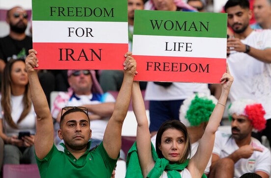 Barred from stadiums at home, Iranian women attend Football World Cup in Qatar