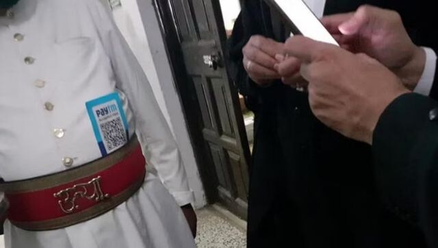 Allahabad HC official suspended after image wearing payment scan code goes viral Allahabad HC official suspended after image wearing payment scan code goes viral