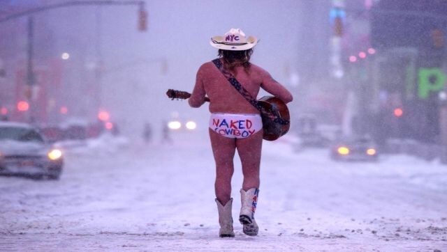 Snow Bomb: The Naked Cowboy performs during a snow storm in Times Square, New York on 29 January. A powerful winter storm packing heavy snow and high winds pummeled the US East Coast forcing the cancellation of thousands of flights as severe weather alerts were sounded across a region of around 70 million people. AFP Snow Bomb: The Naked Cowboy performs during a snow storm in Times Square, New York on 29 January. A powerful winter storm packing heavy snow and high winds pummeled the US East Coast forcing the cancellation of thousands of flights as severe weather alerts were sounded across a region of around 70 million people. AFP
