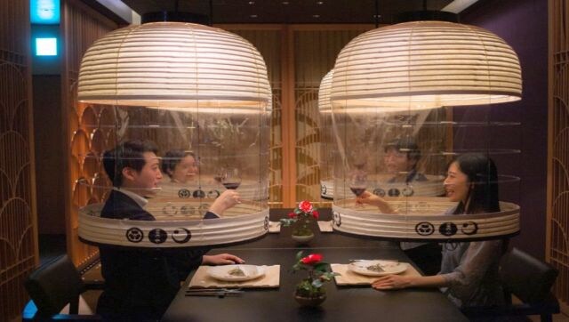 A Bright Idea: Staff members from the Hoshinoya Tokyo hotel demonstrate the “Lantern Dining Experience”, where lanterns made by Kojima Shoten – a shop in Kyoto – are used to shroud diners for mask-free dining amid the COVID-19 coronavirus pandemic in Tokyo. AFP A Bright Idea: Staff members from the Hoshinoya Tokyo hotel demonstrate the “Lantern Dining Experience”, where lanterns made by Kojima Shoten – a shop in Kyoto – are used to shroud diners for mask-free dining amid the COVID-19 coronavirus pandemic in Tokyo. AFP