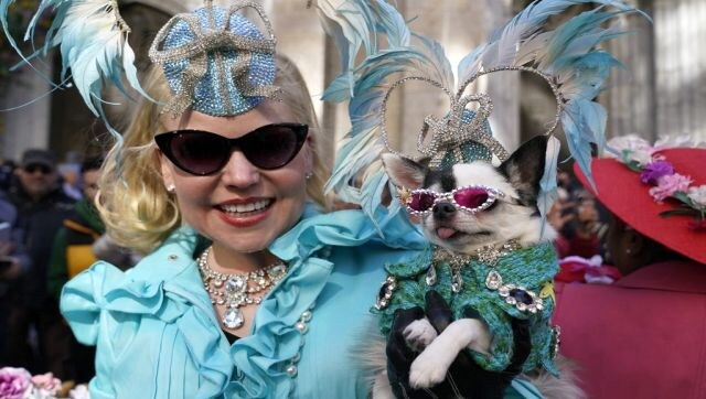 Doggie’s Day Out: Summer Strand and her dog during the annual Easter Parade and Bonnet Festival on Fifth Avenue in front of St. Patrick’s Cathedral in New York City on 17 April. AFP Doggie’s Day Out: Summer Strand and her dog during the annual Easter Parade and Bonnet Festival on Fifth Avenue in front of St. Patrick’s Cathedral in New York City on 17 April. AFP