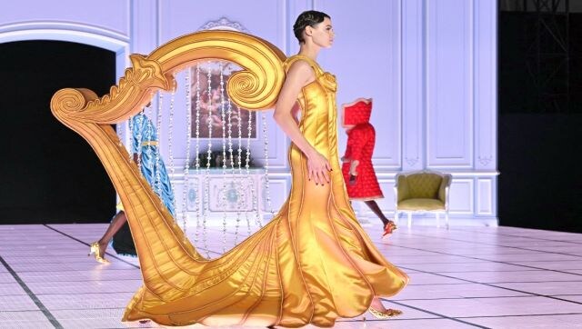 Walking to Her Own Tune: A model presents a creation during the Moschino catwalk show for the Fall/Winter 2022/2023 collection on the third day of the Milan Fashion Week in Milan on 24 February. AFP Walking to Her Own Tune: A model presents a creation during the Moschino catwalk show for the Fall/Winter 2022/2023 collection on the third day of the Milan Fashion Week in Milan on 24 February. AFP