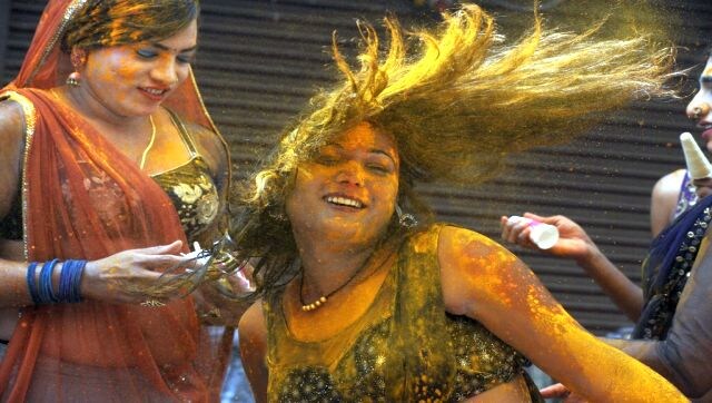 Hair Scare: Revellers smeared in coloured powder dance during the Holi celebrations, the spring festival of colours, in Hyderabad on 17 March. AFP Hair Scare: Revellers smeared in coloured powder dance during the Holi celebrations, the spring festival of colours, in Hyderabad on 17 March. AFP