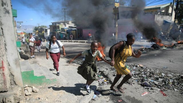 Civilians, police protest against gang violence in Haiti after murder of six officers