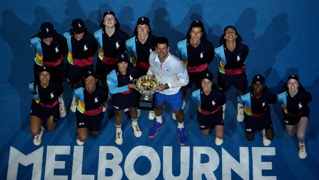 Champion Novak Djokovic poses with ballboys and girls at the Rod Laver Arena at the conclusion of the 2023 Australian Open. AP Champion Novak Djokovic poses with ballboys and girls at the Rod Laver Arena at the conclusion of the 2023 Australian Open. AP