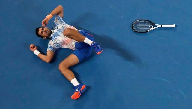 Novak Djokovic falls over while attempting a shot during the Australian Open men’s singles final clash against Stefanos Tsitsipas. AP Novak Djokovic falls over while attempting a shot during the Australian Open men’s singles final clash against Stefanos Tsitsipas. AP