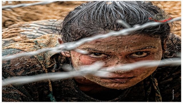 Eye of the Tigress: A female commando during the strenuous obstacle course training crawling through barbed wires. Image Courtesy: Pravin Talan Eye of the Tigress: A female commando during the strenuous obstacle course training crawling through barbed wires. Image Courtesy: Pravin Talan