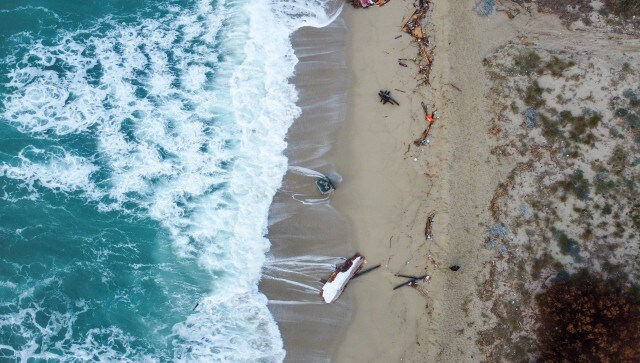 The boat collided with the reefs in wind-whipped seas. Three big chunks of the vessel ended up on the beach near the town of Steccato di Cutro, where splintered pieces of bright blue wood littered the sand like matchsticks. AP
